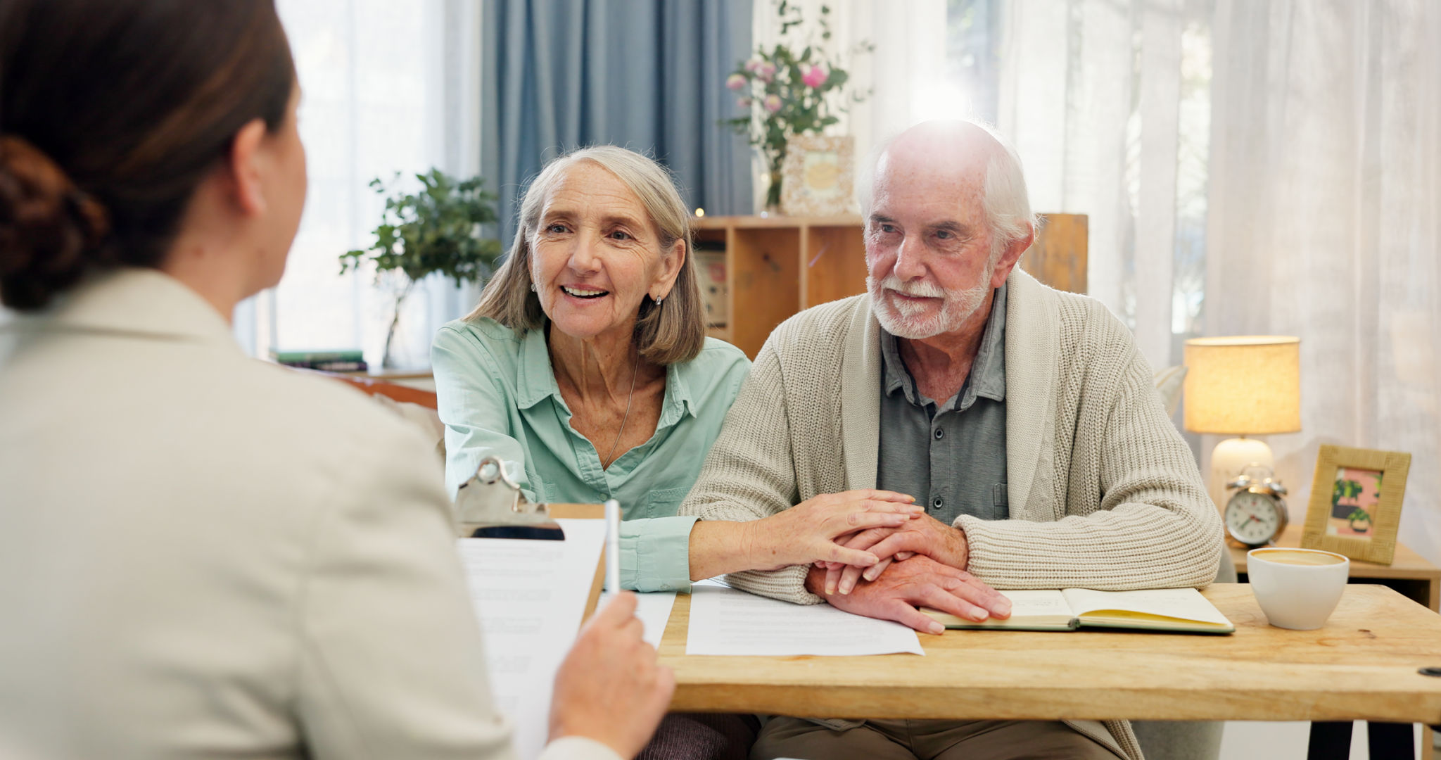 Senior couple in compassionate care consultation with ElderBridge